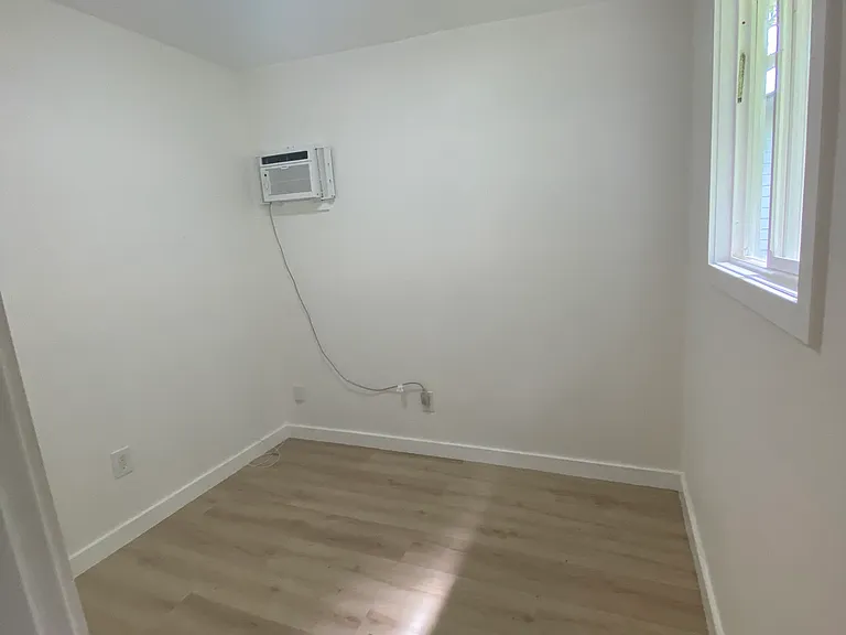 A hideaway office nook with in wall AC to keep you cool when working from home