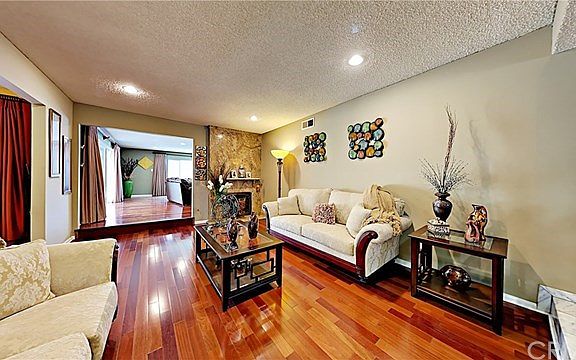 Formal Living Room Features Unique Marbel Fireplace