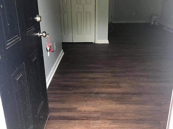 Walking through the front door Into the living-room.