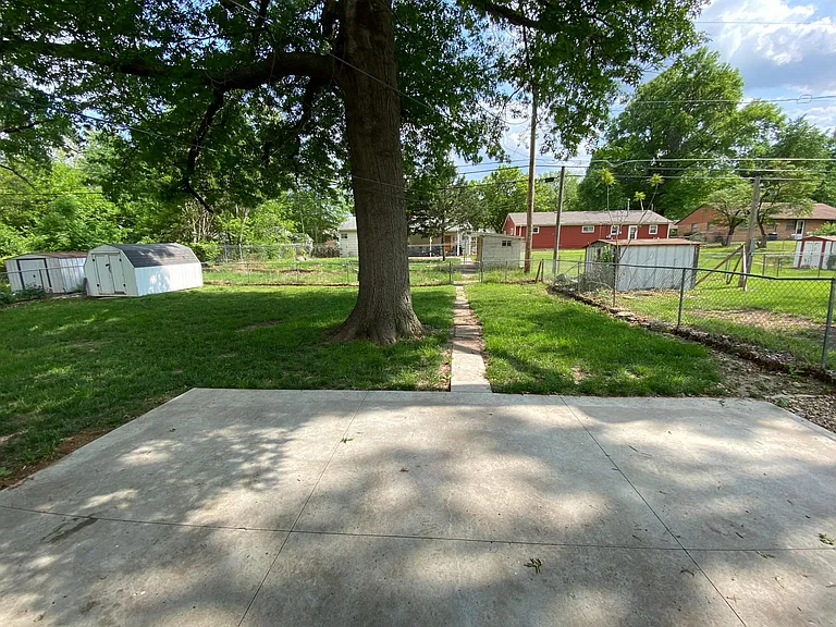 Patio space from back door to back fence line.