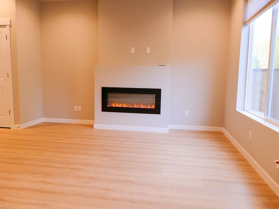 Look from the right corner of the living room toward fireplace