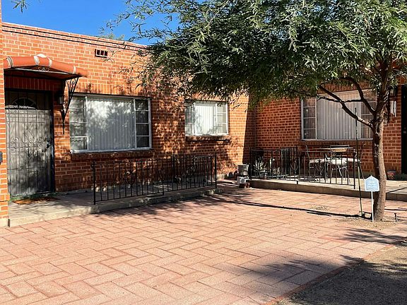 Front of unit with shaded tree