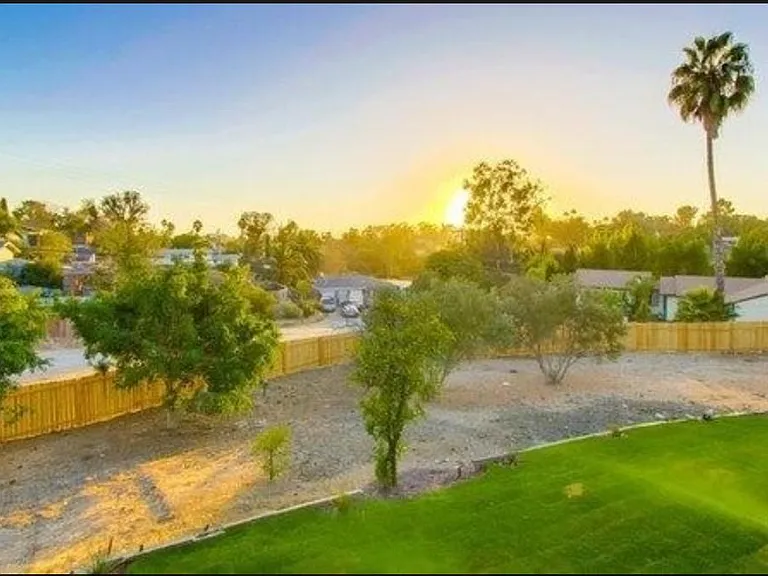 Lawn pictured is no longer present, but the Sunset View from your deck sure is