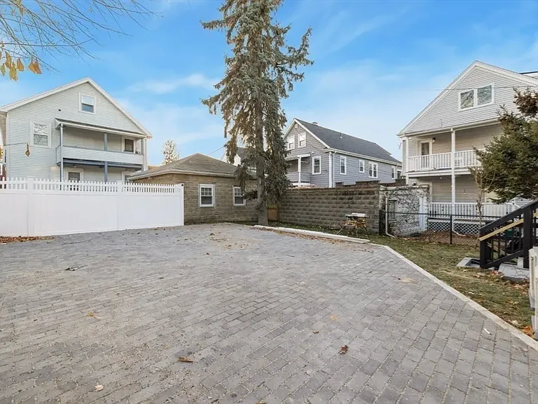 Rare Somerville perk: Dedicated off-street parking located conveniently at the rear of the property.