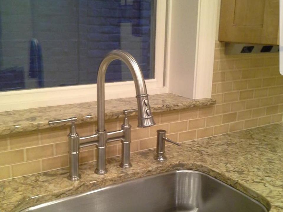 Elkay Faucet with pull down spray.