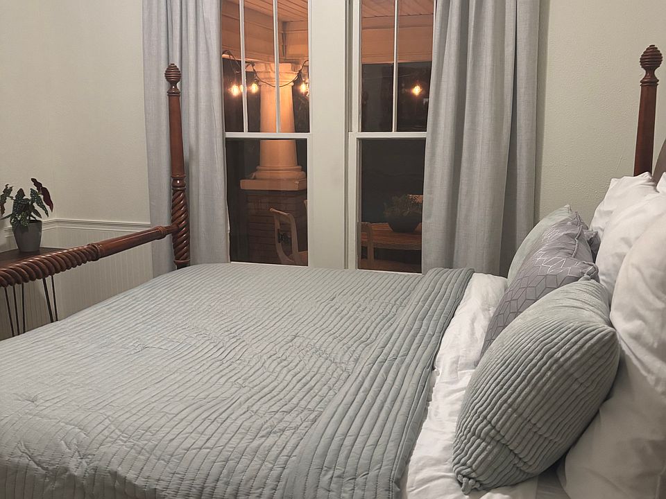 king bedroom overlooking river and porch