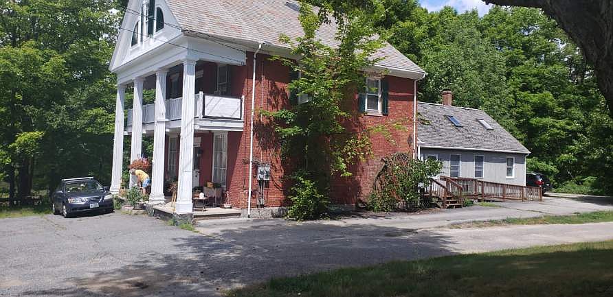 apartment is located on first and 2nd floor of former barn, grey section in rear
