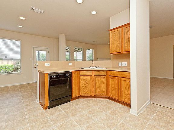 HIGH BREAKFAST BAR OPEN TO FAMILY ROOM