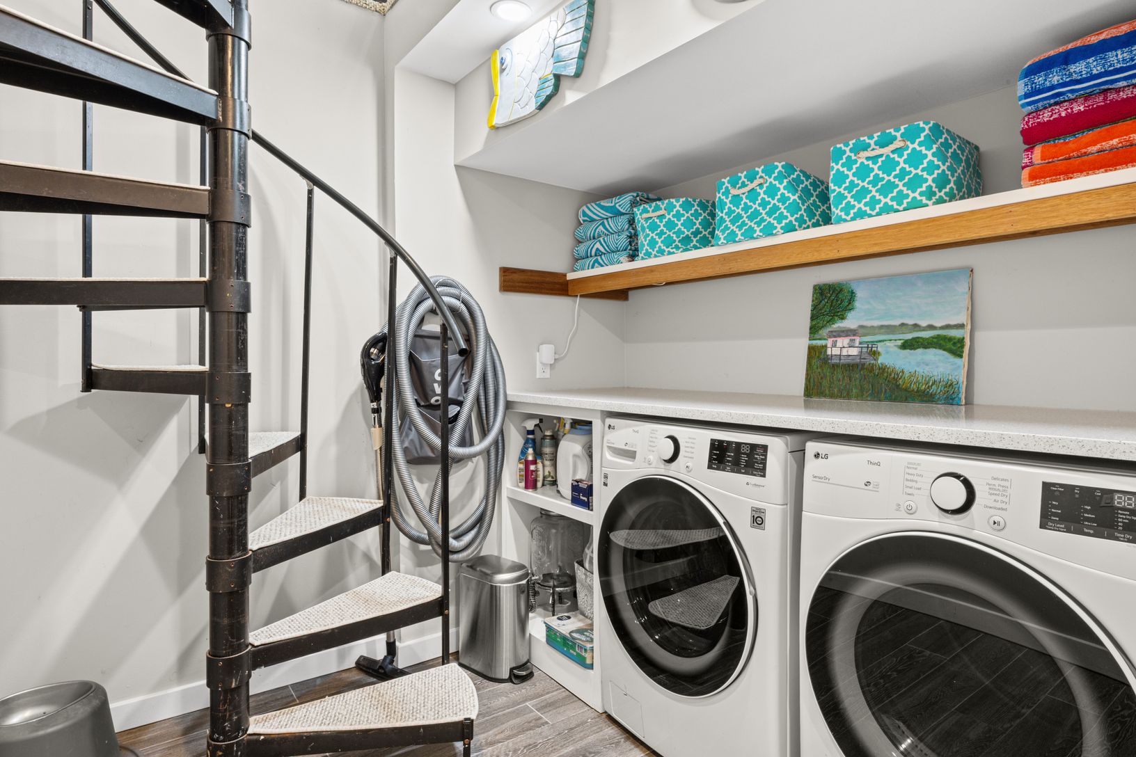  laundry room and stars to the storage room over the garage