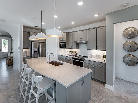 Large kitchen island with quartz countertops