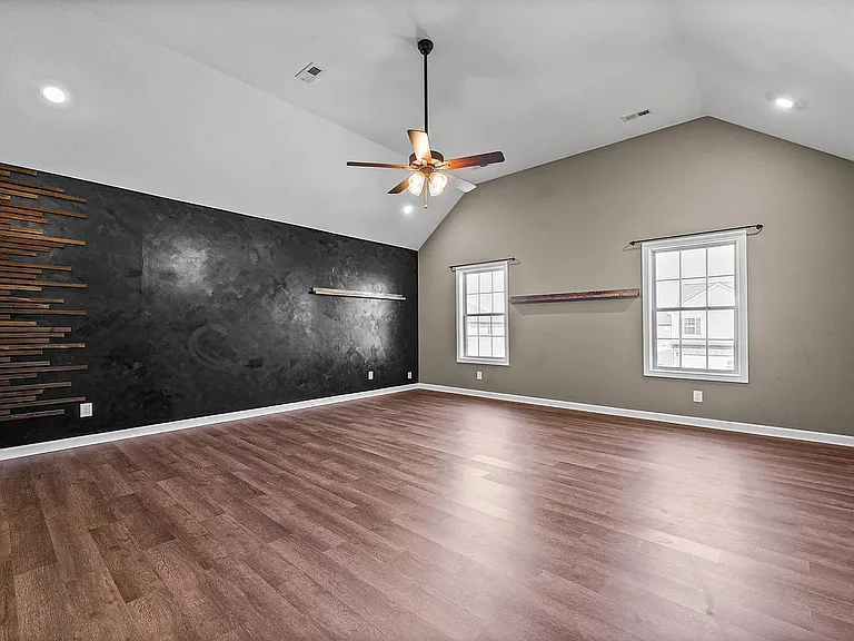 Large Bonus Room 19'x21'. Previously used as a combo space for playroom, office, and guest bedroom. Does have a large walkin closet.