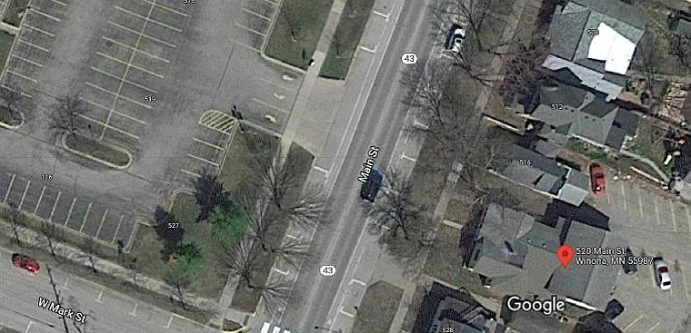 Across the street from the IWC. Large parking lot behind the house.