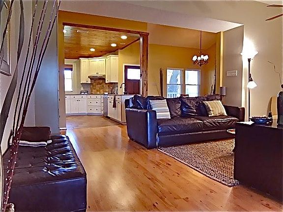 Example of the arrangement of furniture in the home. Note: the dining room walls have been painted and are no longer gold.