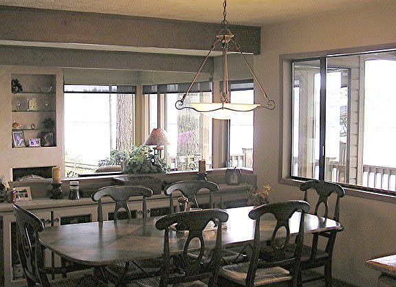 The dining room has a lighted glass buffet & a bar area.