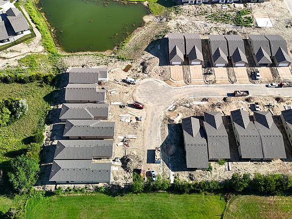 Under construction photo, property in top center just right of the pond.