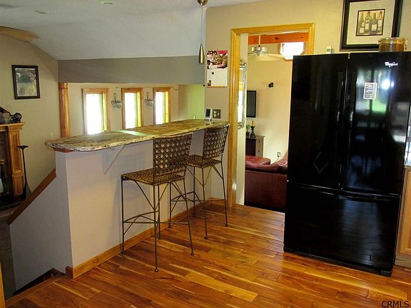 Whirlpool refrigerator and dishwasher, GE Profile slide-in gas range, Samsung microwave