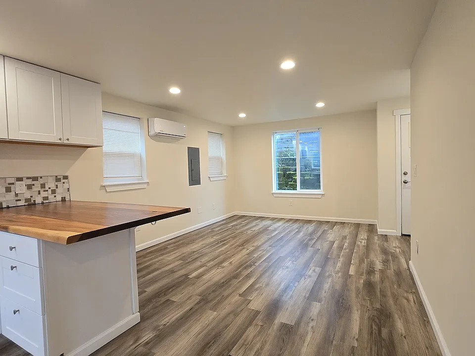 Open concept living space flows into the kitchen for flexible layouts and easy entertaining.