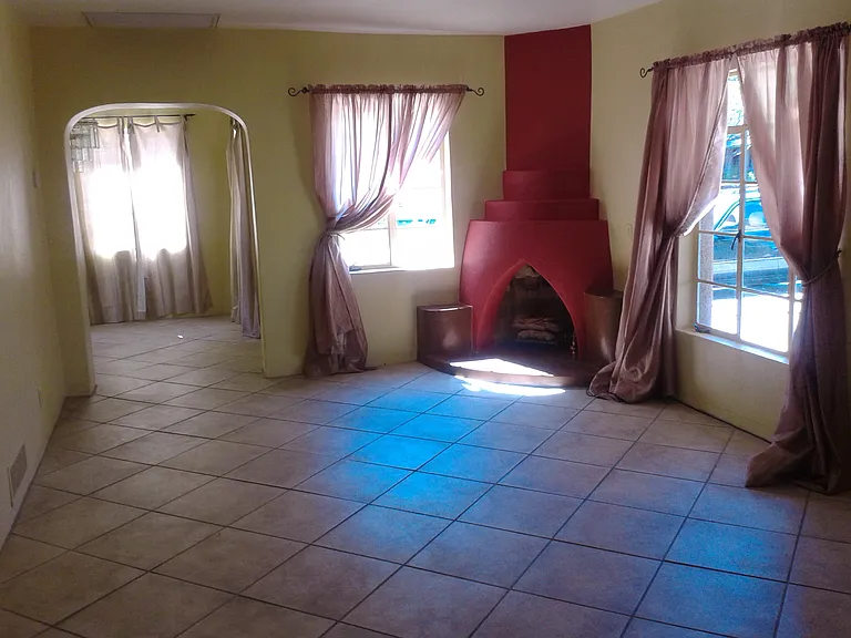 living room with beehive fireplace