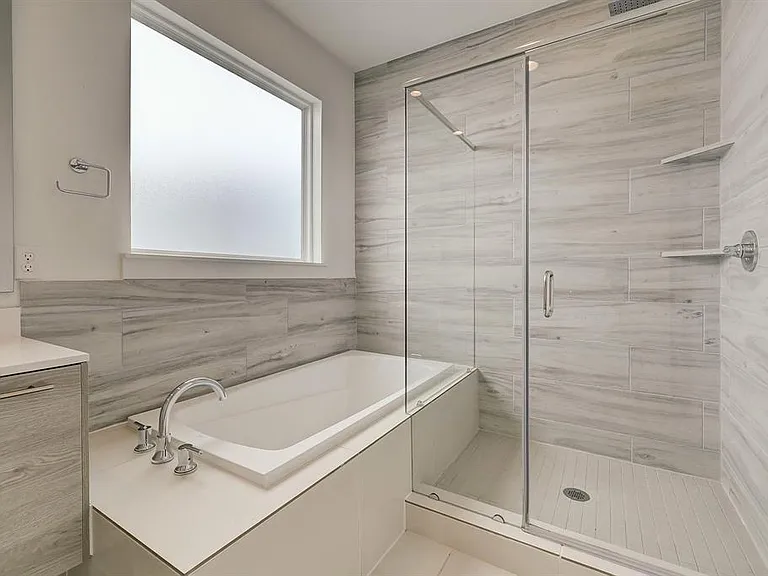 The master bathroom has a separate shower and tub.