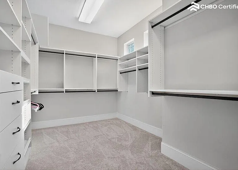 Walk in closet with built-in shelving