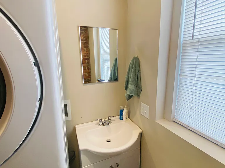 First Floor Half bath with stack washer/ dryer