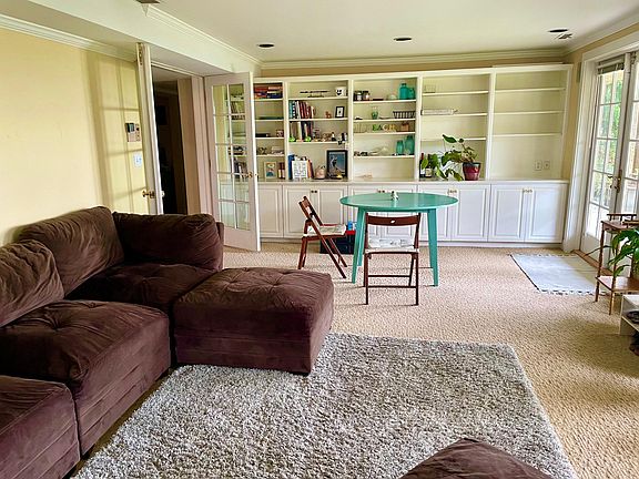 Great room with built in bookcase and cabinets