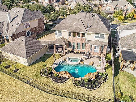 This birds eye view shows the true beauty of this backyard space and the size of the amazing pool, that is sure to be the favorite gathering spot of all your friends and family!