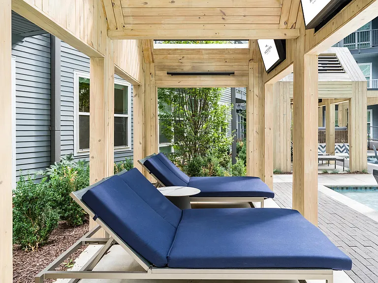 Unwind beneath shaded cabanas at Modera Old Ivy, where cushioned loungers and landscaped courtyards create a relaxed poolside retreat in Atlanta.