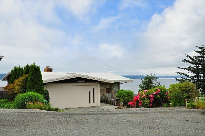 Beautiful corner location already inviting you in to enjoy the open floor plan and views of Puget Sound
