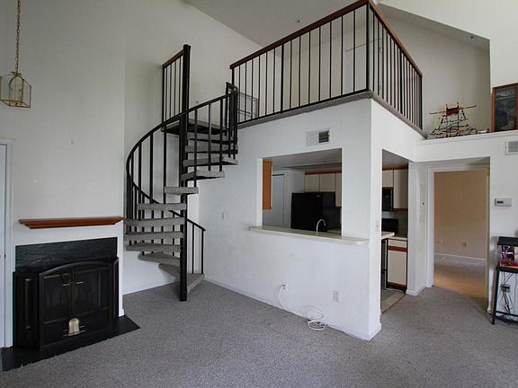 living room with view of loft