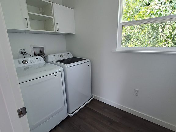 Brand new washer and dryer in laundry room. Plenty of storage.