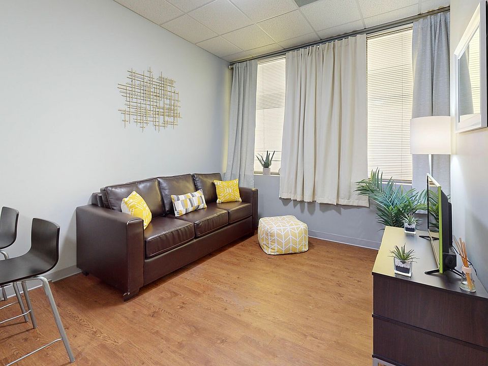 Bright Living Room with Natural Light at University Plaza NIU Off-Campus Apartments
