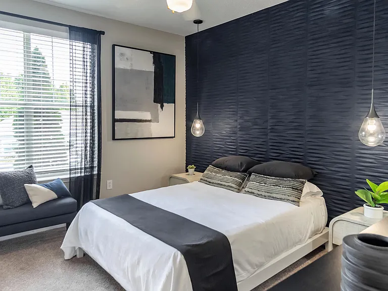 Discover blissful tranquility in our expansive bedroom oasis, complete with sunlit views and multi-speed ceiling fans.