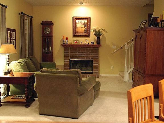 Great Room with gas fireplace and back stairway leading up.