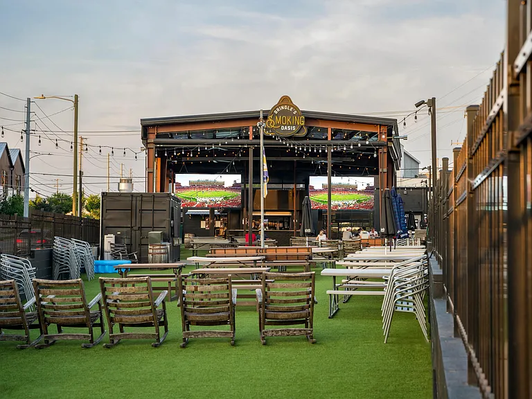 Bring the crew to Bringle's Smoking Oasis, a lively local favorite for bold BBQ, cold drinks, and big-screen sports_all just moments from Modera Nations.
