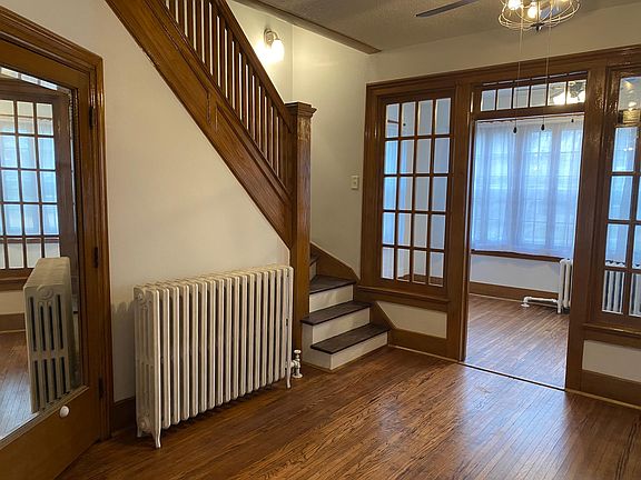 Foyer, closet (with mirror), sunroom, and stairs to bedrooms and 2nd bathroom