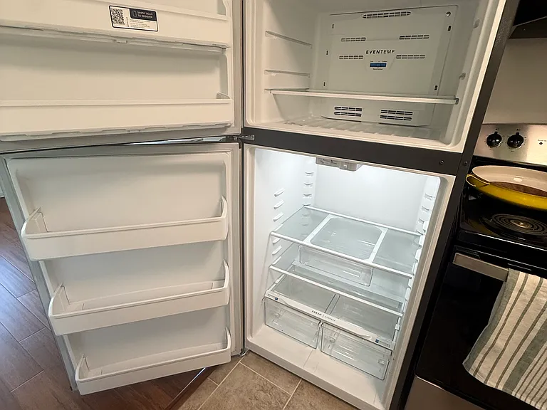 Brand new Frigidaire stainless steel refrigerator/freezer