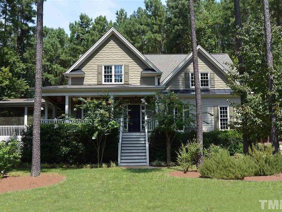 Lovely Home nestled on a Landscaped .94 Acre Lot with Fiber Cement Siding, Wrap Around Porch & Screened Porch. Country Living at its BEST, in a Great Neighborhood w/Clubhouse, Swimming Pool, Playground Area & Community Garden. Storage Area under Porch.