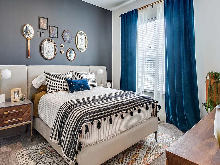 Griffis Frisco apartment bedroom with plush carpet.