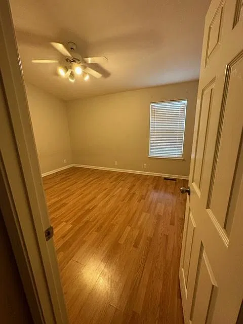 Master bedroom, it looks yellow in this picture, but is is actually beige.
