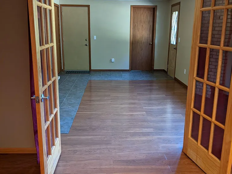 From inside basement bedroom to basement living room, walkout basement to backyard