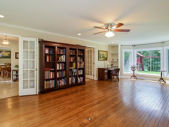 Front-to-back living room with bay window provides great views of back yard