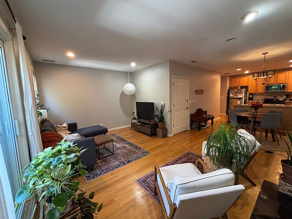 Spacious and light filled living room with open concept to kitchen
