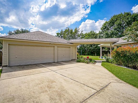 View of 3 car detached garage with 10 foot extension-wait until you see inside the garage!