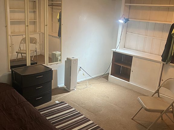 Bed against wall _ multipurpose clothing unit HEPA filter