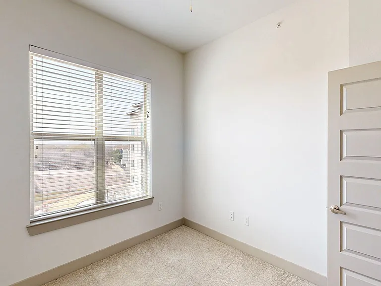 Spacious apartment Bedroom with Carpet Floor.