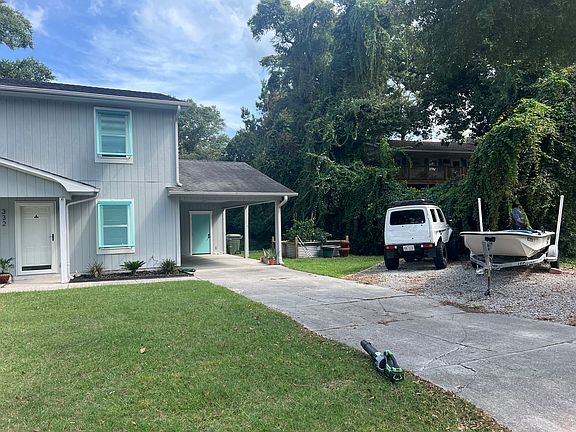 South unit side yard and drive way.