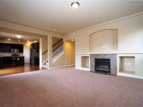 Family room leads into eat-in kitchen.