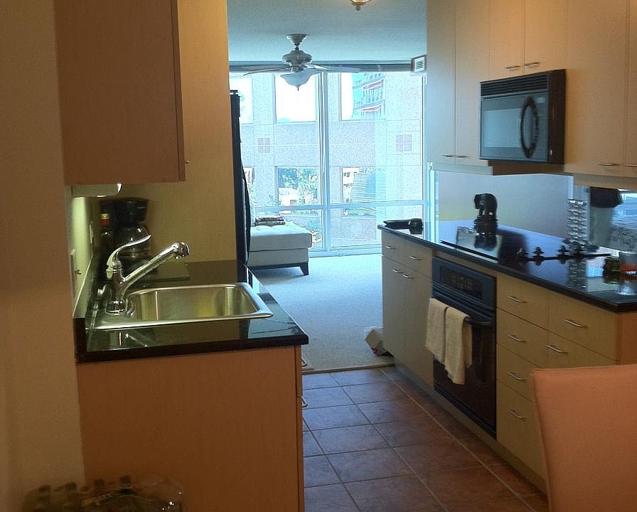 Split floor plan kitchen divides living and dining area