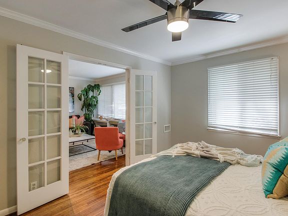 Love the French doors at the entrance of this bedroom, such a unique touch.